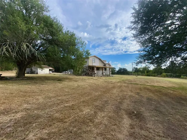 a view of house with outdoor space