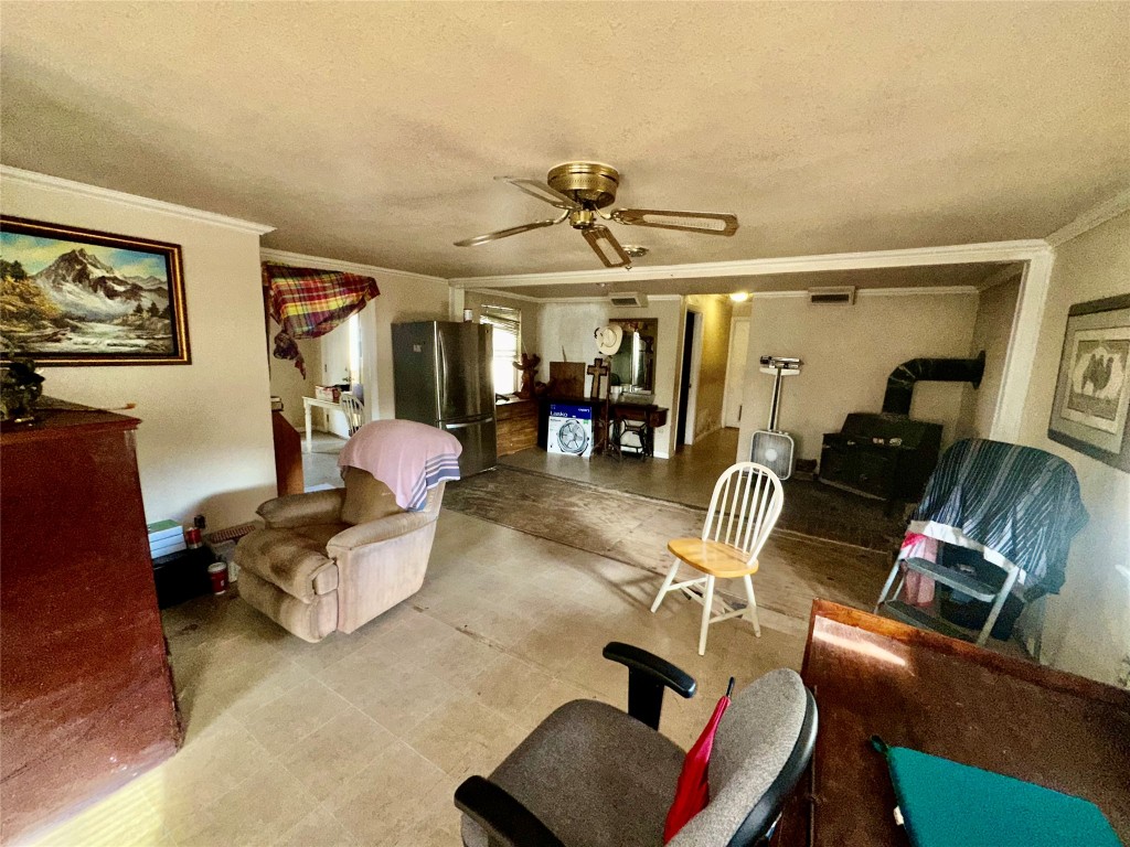 109 Wayside Drive Elgin, TX 78621 - Photo 10 of 31 a living room with furniture and gym equipment