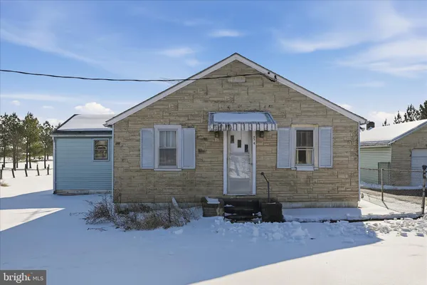 a front view of a house with yard