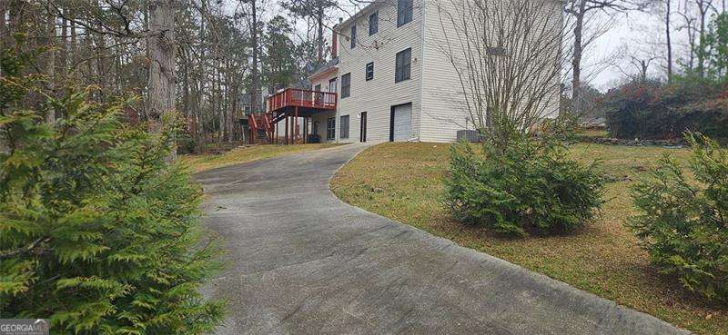 3715 Millers Pond Way Southwest Snellville, GA 30039 - Photo 13 of 13 a view of a street with a building in the background