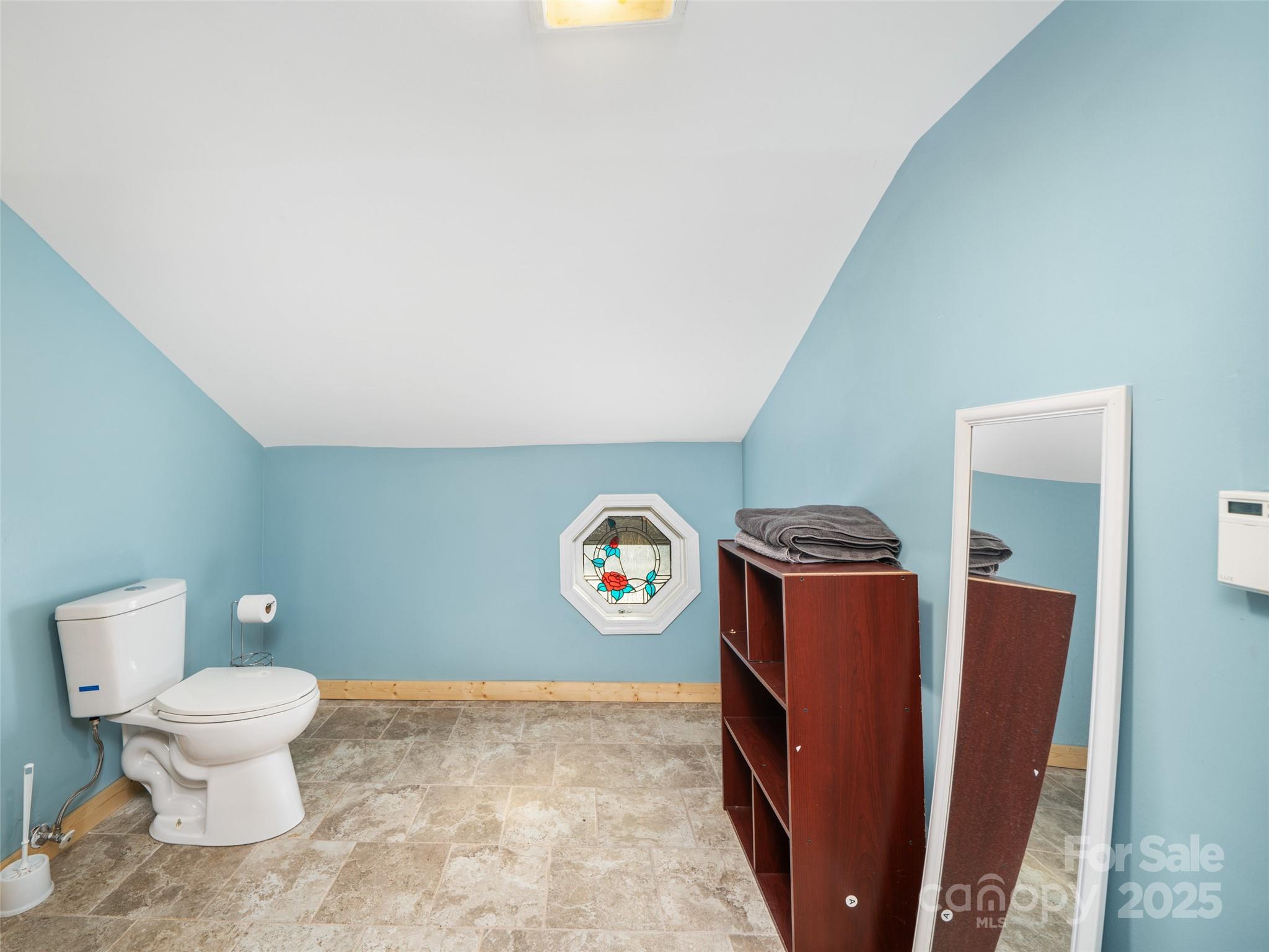 23 Katie's Road, Unit 145 95 ACRES Marshall, NC 28753 - Photo 26 of 48 a view of bathroom with granite countertop toilet and a sink