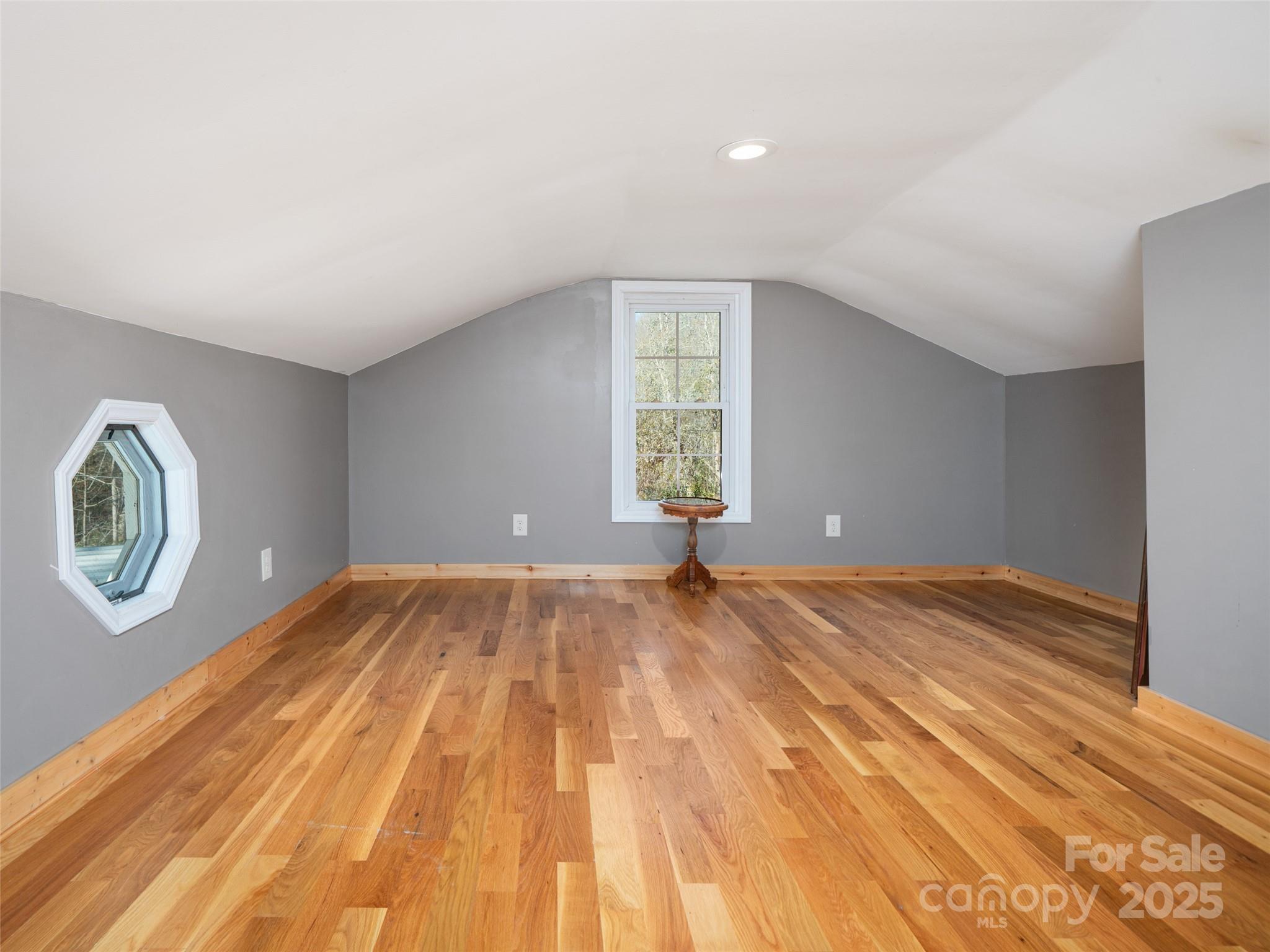 23 Katie's Road, Unit 145 95 ACRES Marshall, NC 28753 - Photo 31 of 48 a view of empty room with window and wooden floor
