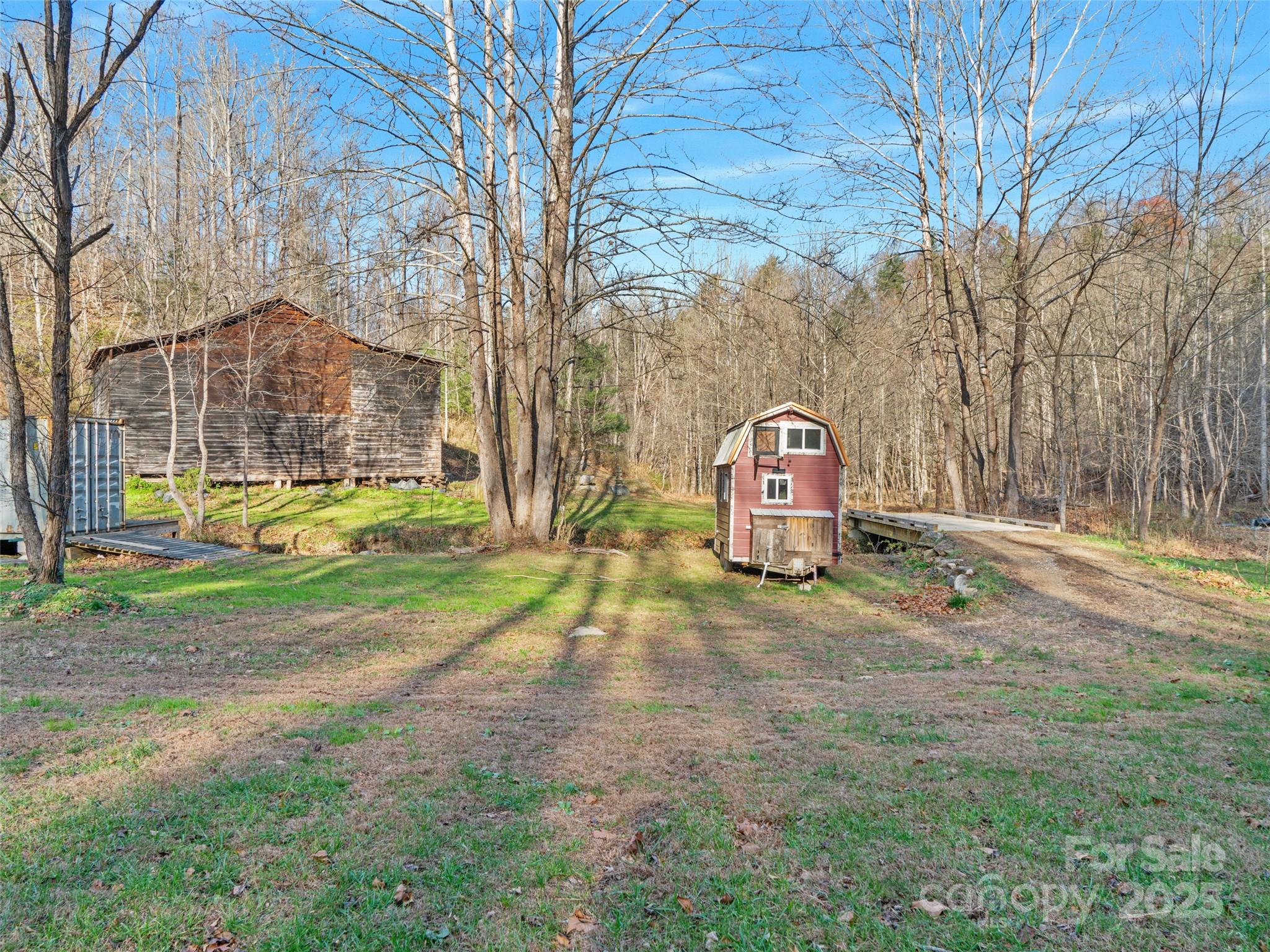 23 Katie's Road, Unit 145 95 ACRES Marshall, NC 28753 - Photo 37 of 48 a view of a yard in front of a house