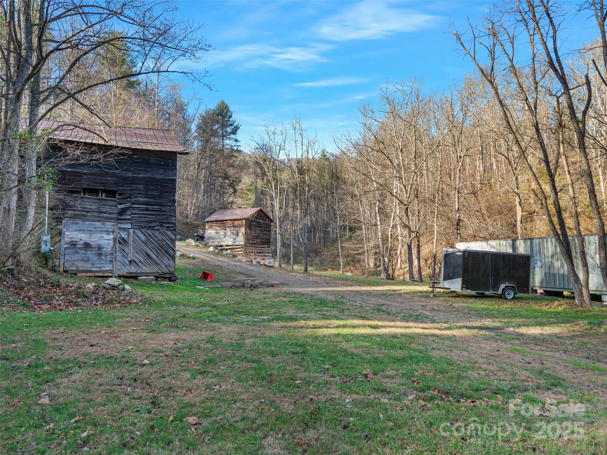 23 Katie's Road, Unit 145 95 ACRES Marshall, NC 28753 - Photo 38 of 48 a view of a house with a yard