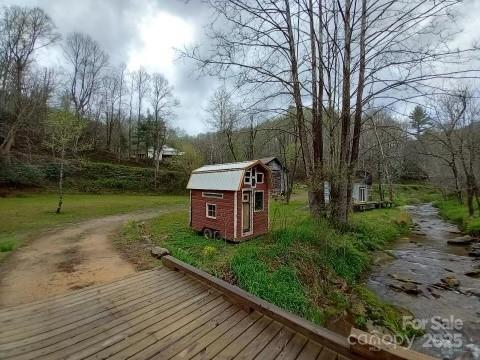23 Katie's Road, Unit 145 95 ACRES Marshall, NC 28753 - Photo 48 of 48 a view of a yard with wooden fence