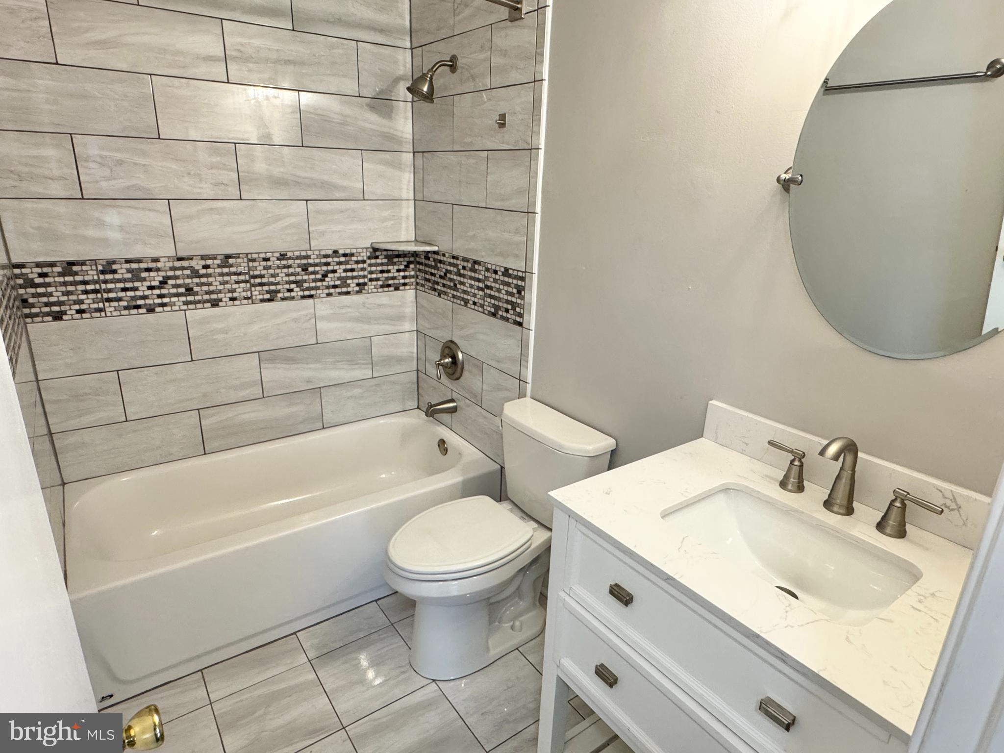 202 Dover Place, Unit 2 Stafford, VA 22556 - Photo 11 of 22 a bathroom with a sink toilet and shower