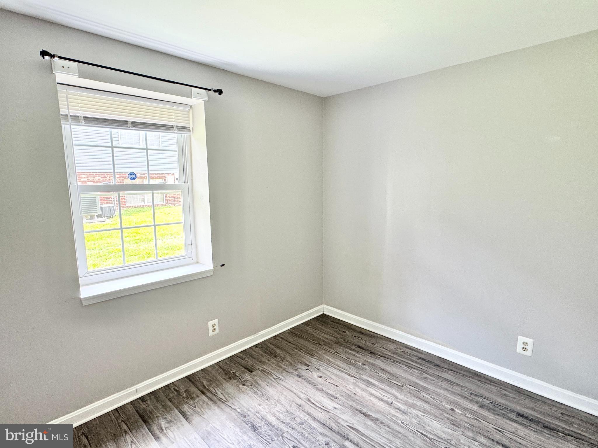 202 Dover Place, Unit 2 Stafford, VA 22556 - Photo 19 of 22 a view of empty room with wooden floor and fan