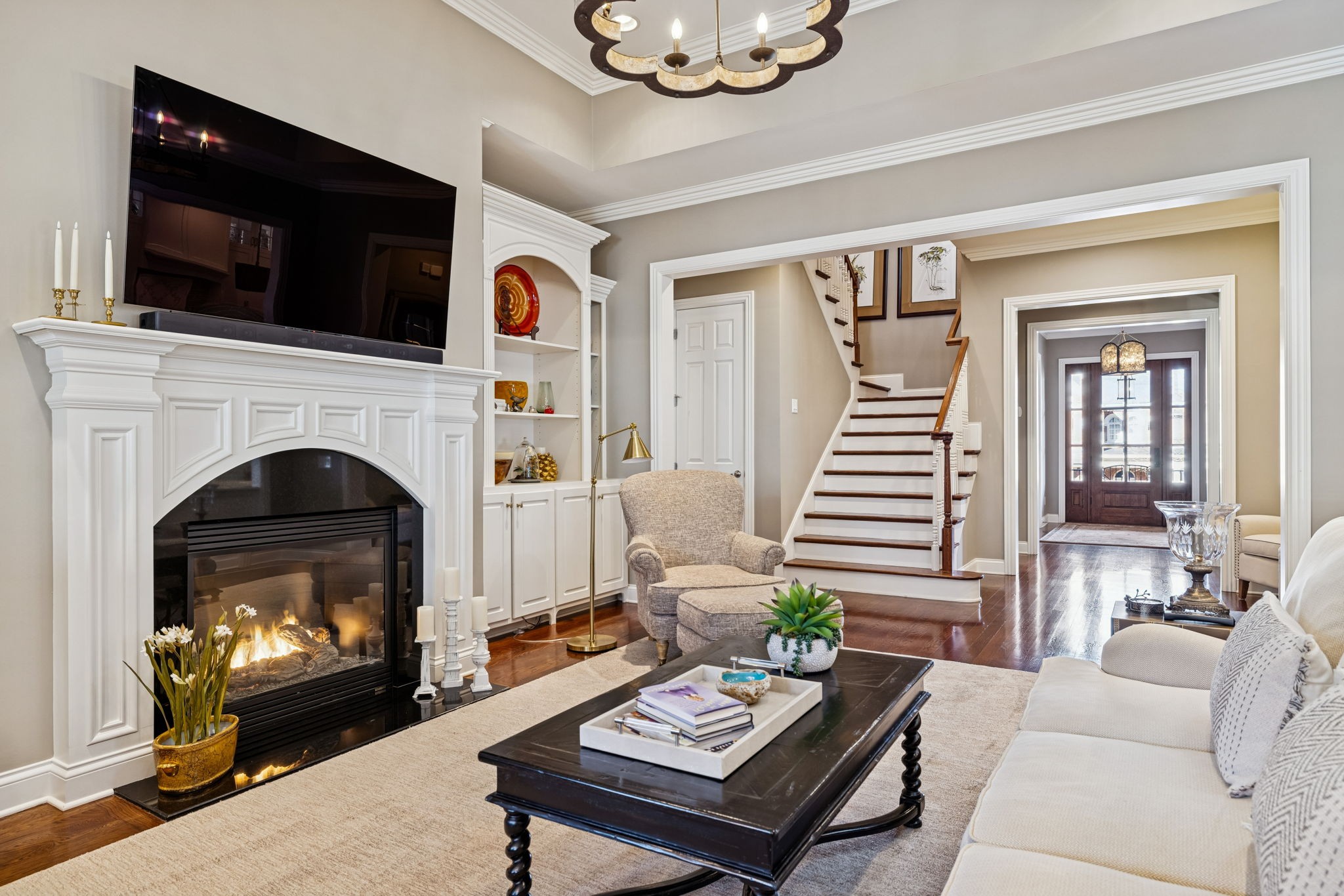 600 Pearre Springs Way Franklin, TN 37064 - Photo 25 of 85 a living room with furniture a flat screen tv and a fireplace
