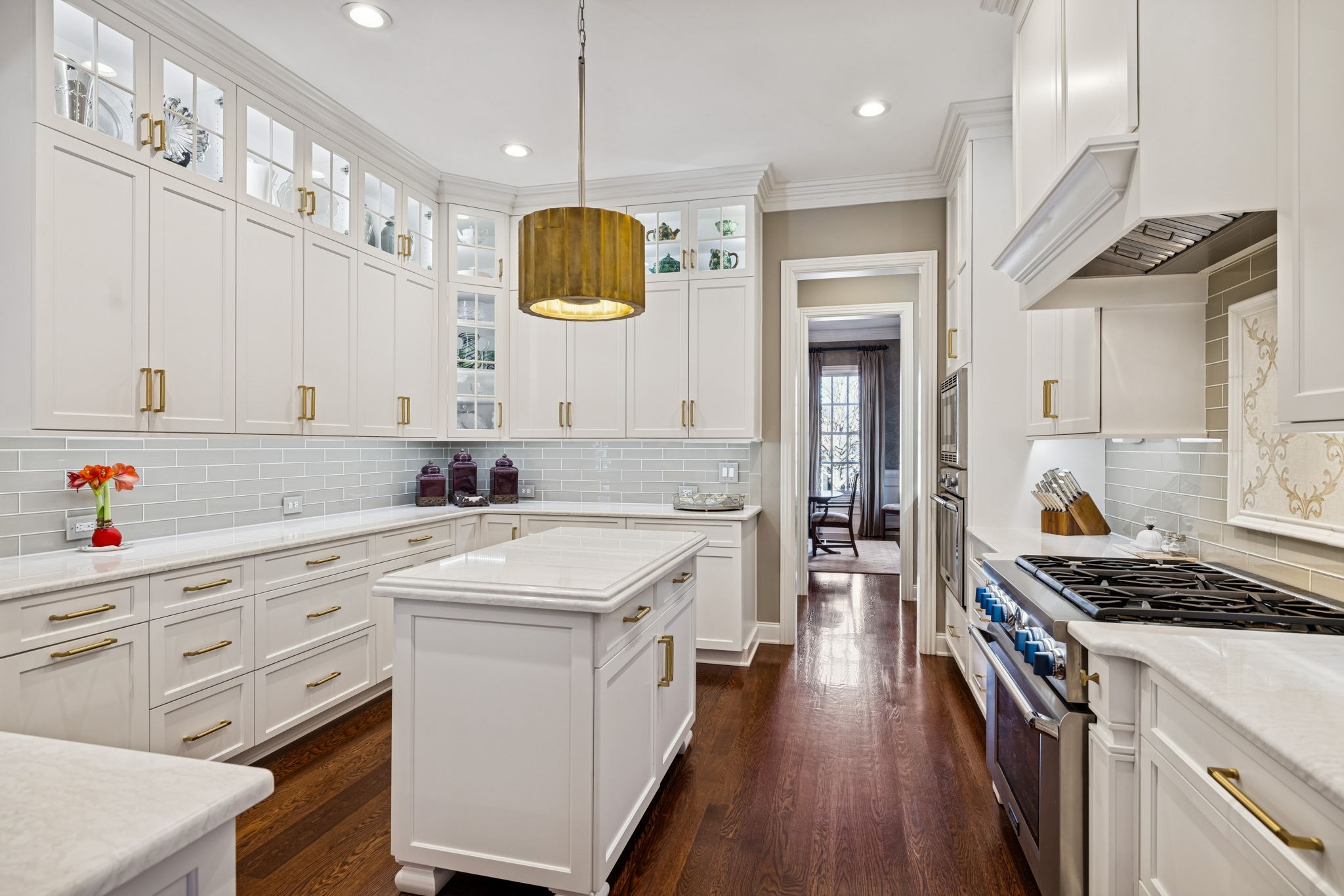 600 Pearre Springs Way Franklin, TN 37064 - Photo 35 of 85 a kitchen with a sink stove and wooden floor