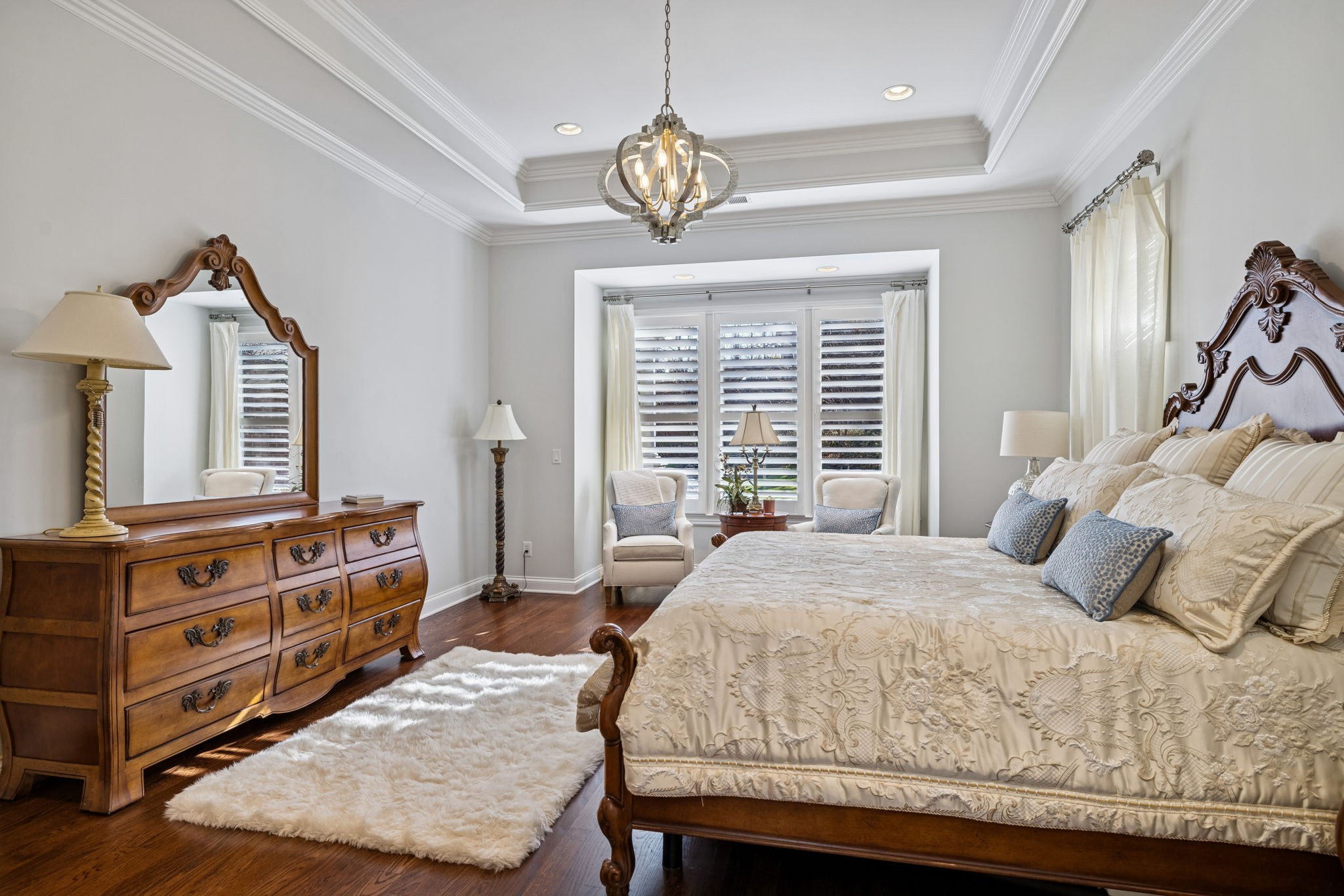 600 Pearre Springs Way Franklin, TN 37064 - Photo 45 of 85 a bedroom with a bed a dresser and a chandelier