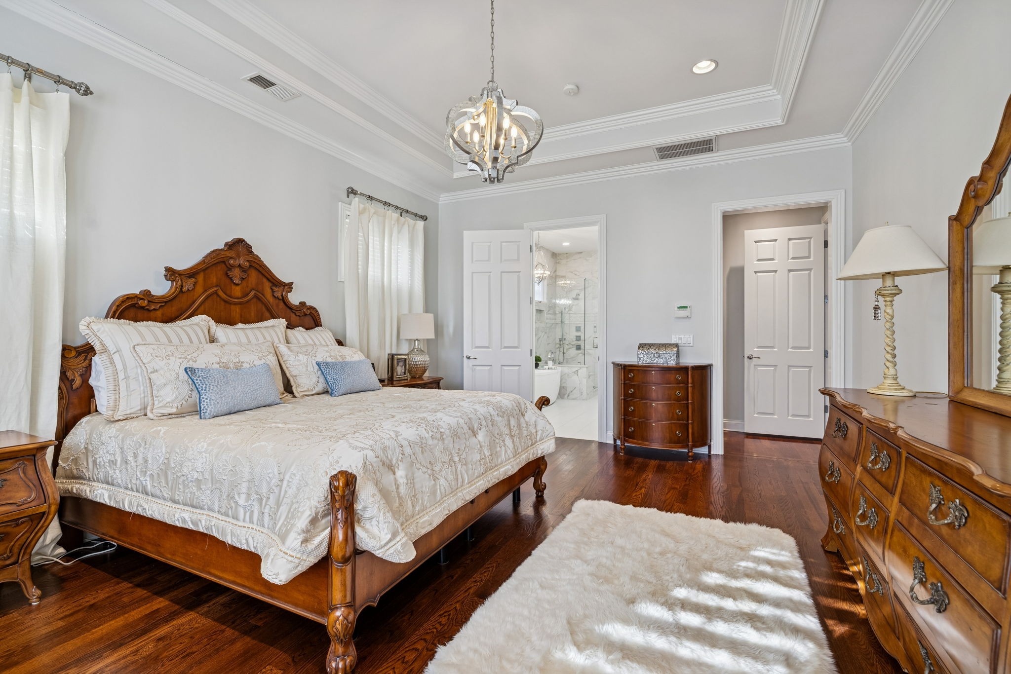 600 Pearre Springs Way Franklin, TN 37064 - Photo 46 of 85 a spacious bedroom with a bed and a chandelier