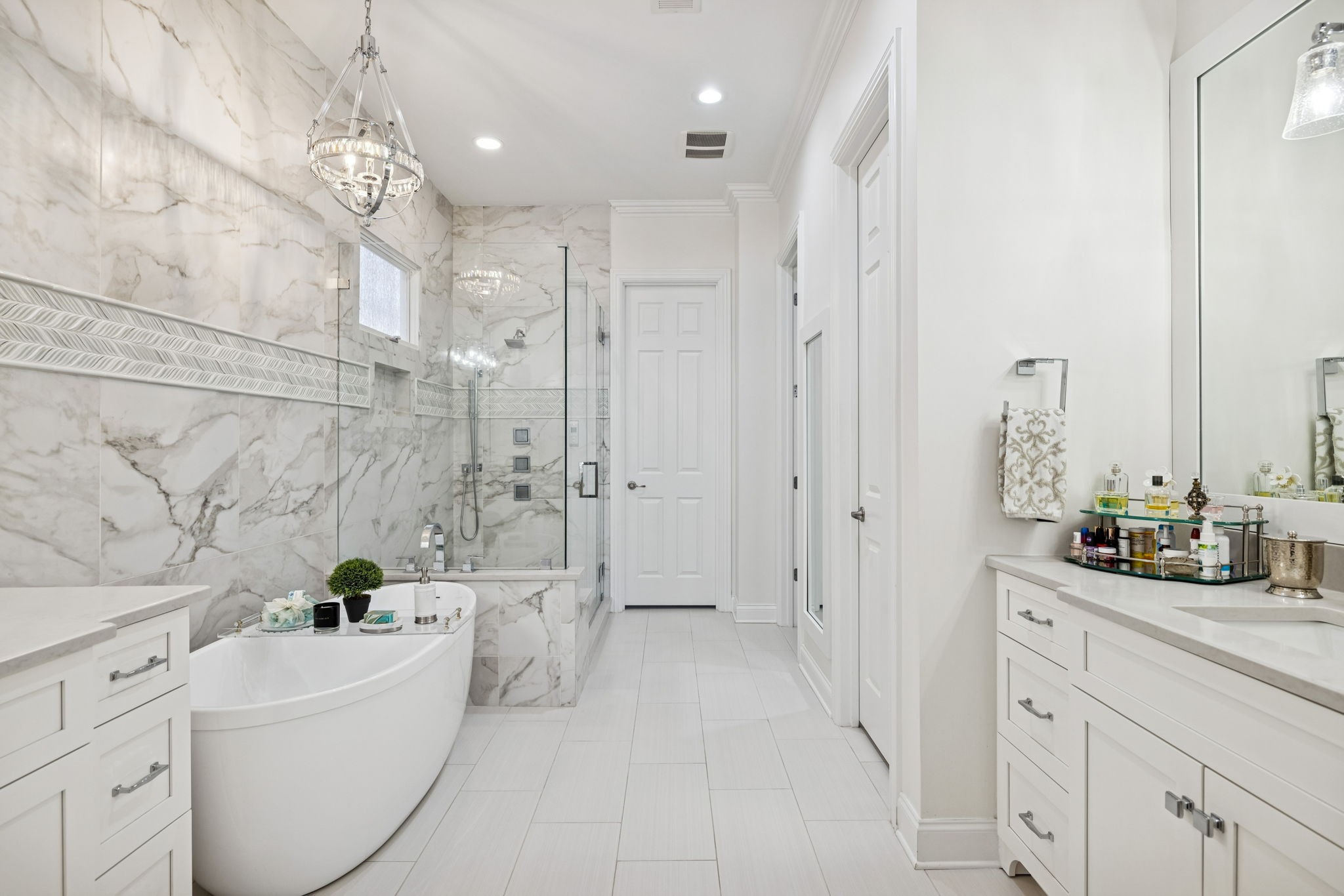600 Pearre Springs Way Franklin, TN 37064 - Photo 47 of 85 a bathroom with a double vanity sink a mirror a bathtub and shower