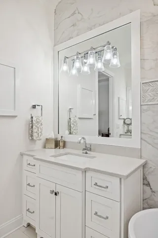 a front view of residential houses and trees