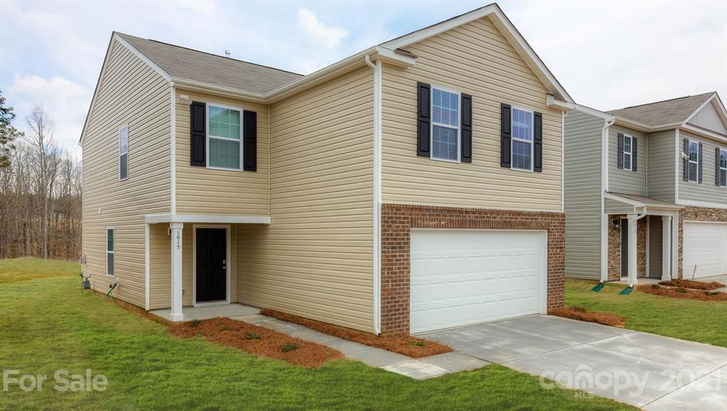 348 Gaines Road Clover, SC 29710 - Photo 2 of 48 a front view of a house with a yard and garage