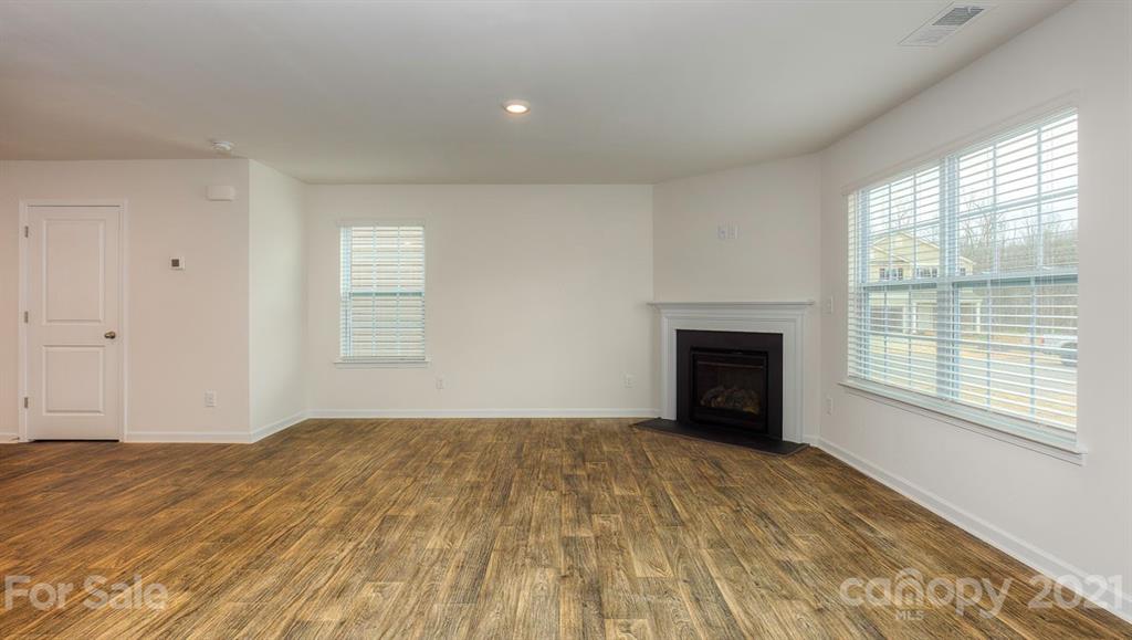348 Gaines Road Clover, SC 29710 - Photo 14 of 48 a view of an empty room with a window and a fireplace