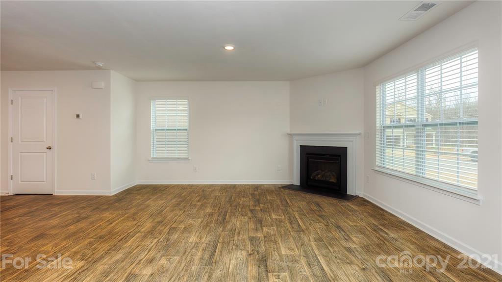 348 Gaines Road Clover, SC 29710 - Photo 42 of 48 a view of an empty room with a window and a fireplace