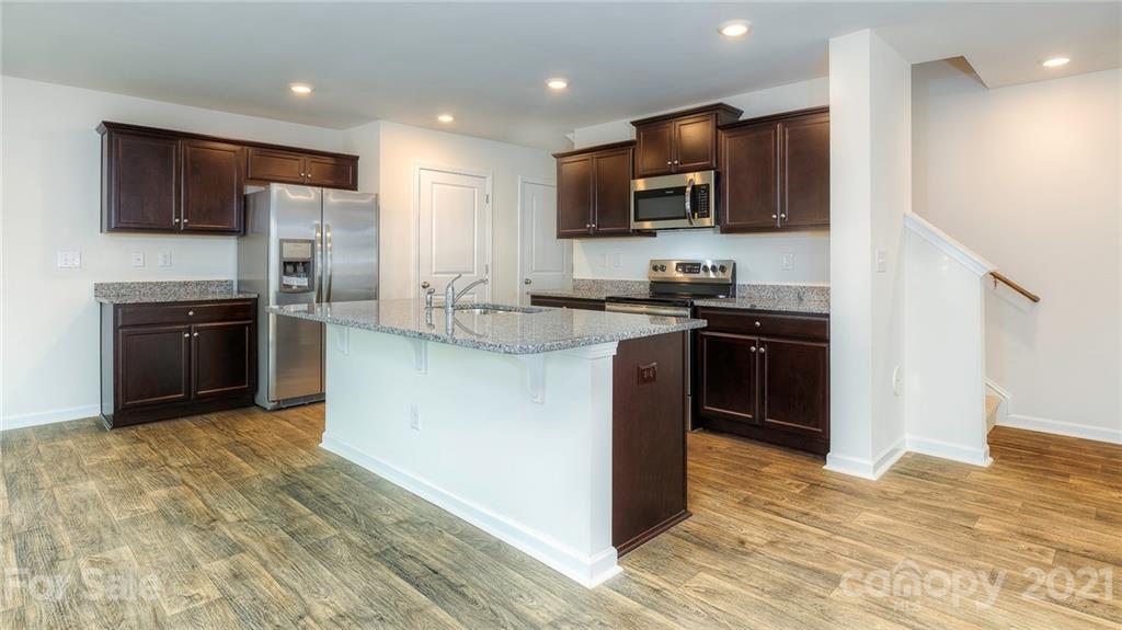 348 Gaines Road Clover, SC 29710 - Photo 48 of 48 a kitchen with stainless steel appliances granite countertop a stove top oven a sink and a granite counter tops