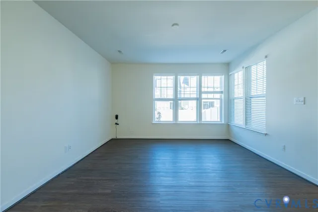 a view of kitchen with wooden floor and window