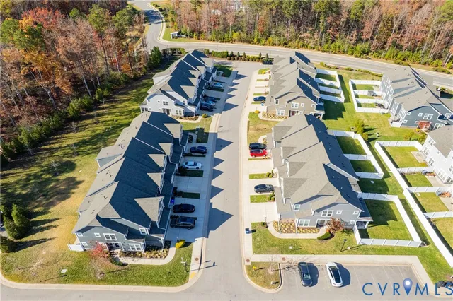an aerial view of a house with a swimming pool