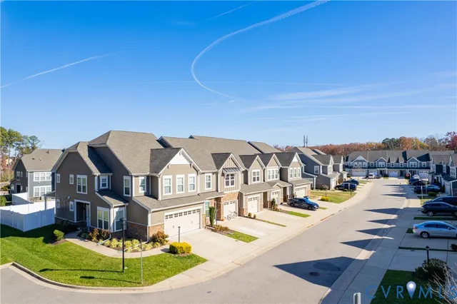an aerial view of a house with a swimming pool