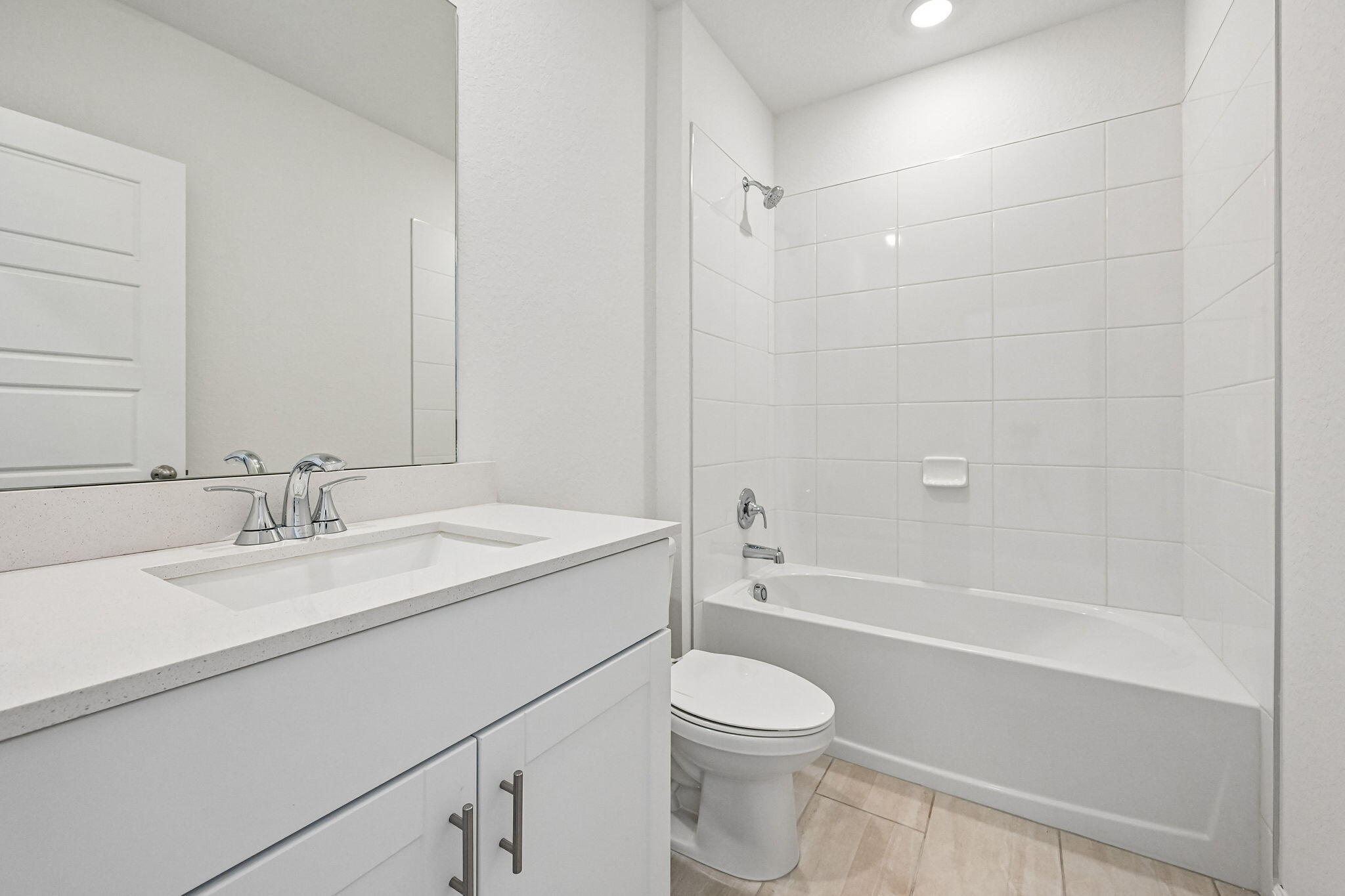 14503 Southwest New Dawn Road Indiantown, FL 34956 - Photo 24 of 42 a bathroom with a bathtub shower sink vanity mirror and toilet