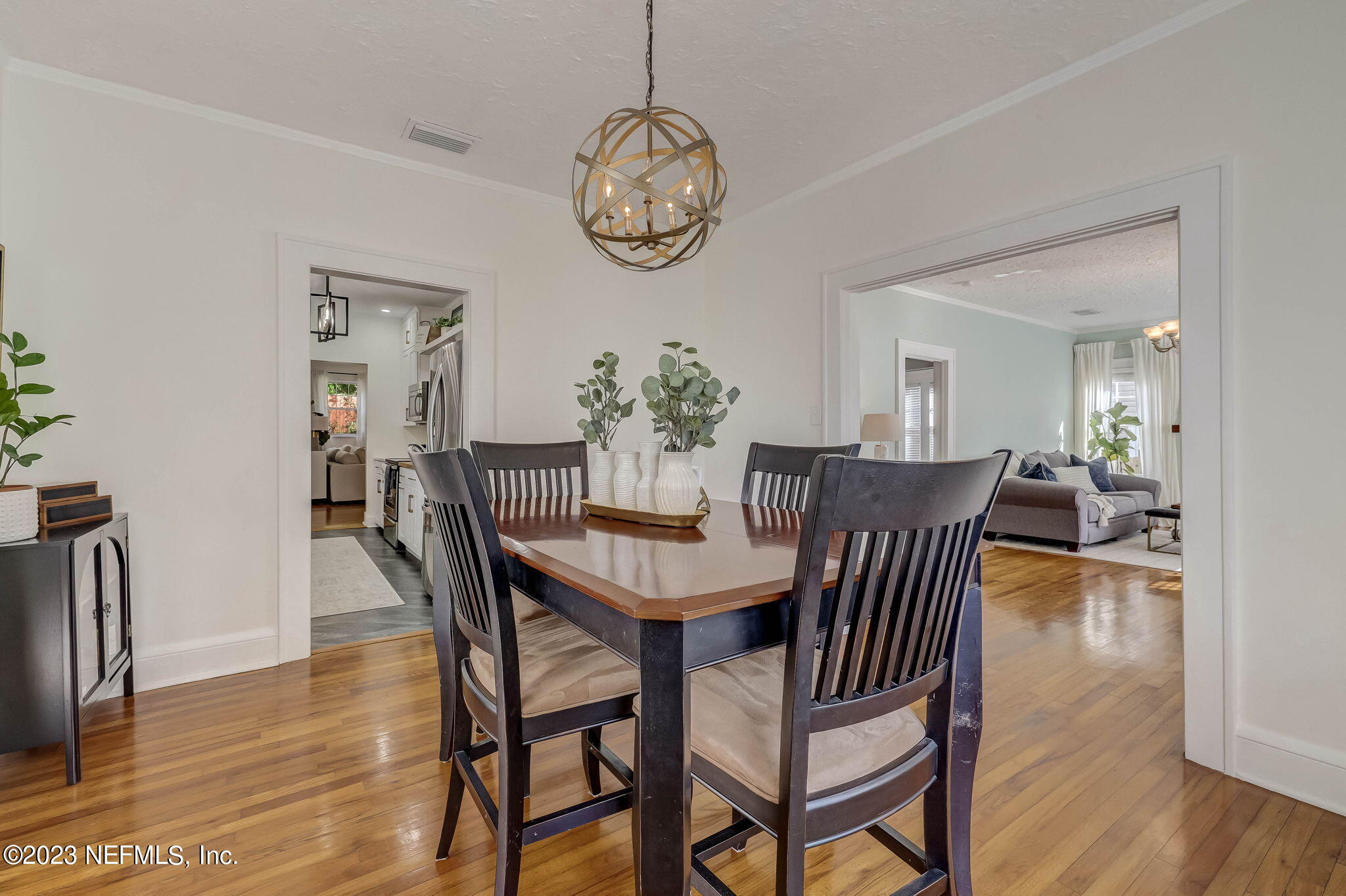 1515 Mayfair Road Jacksonville, FL 32207 - Photo 17 of 52 a view of a dining room with furniture wooden floor and a chandelier