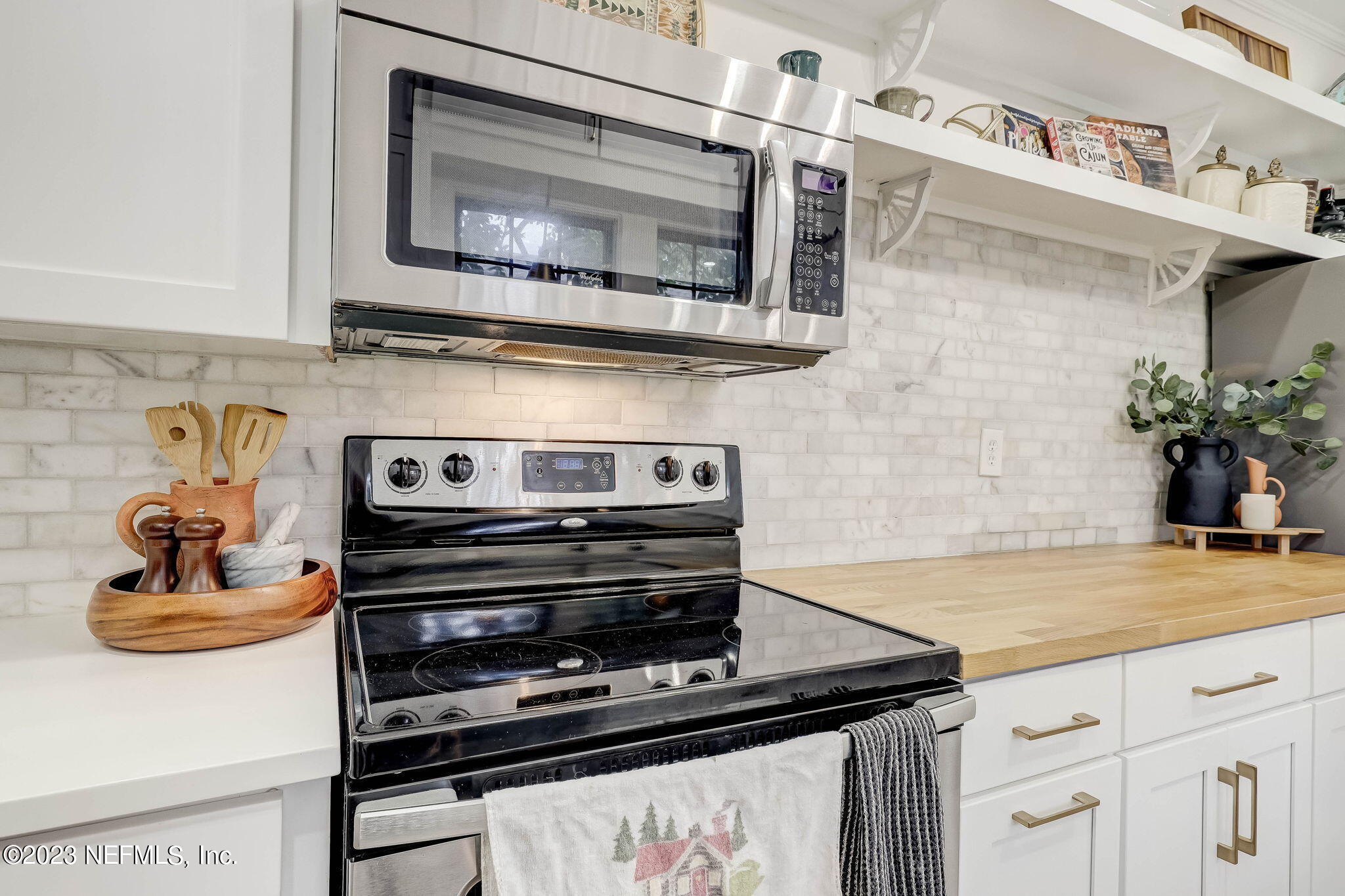 1515 Mayfair Road Jacksonville, FL 32207 - Photo 22 of 52 a kitchen with a stove and a microwave