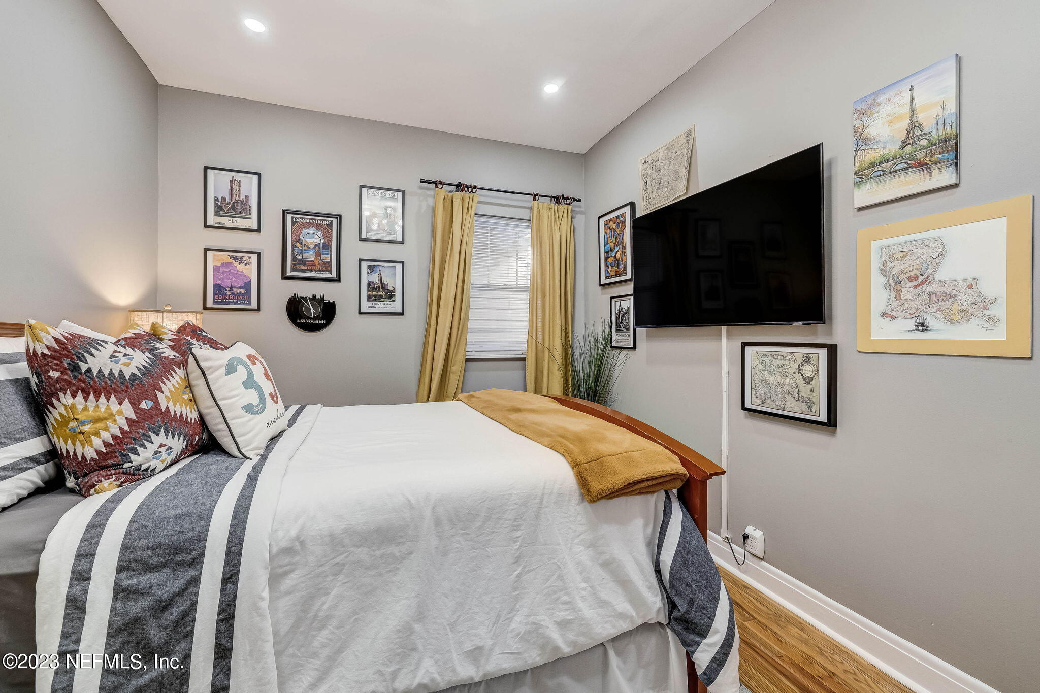 1515 Mayfair Road Jacksonville, FL 32207 - Photo 29 of 52 a bedroom with a bed and a flat screen tv