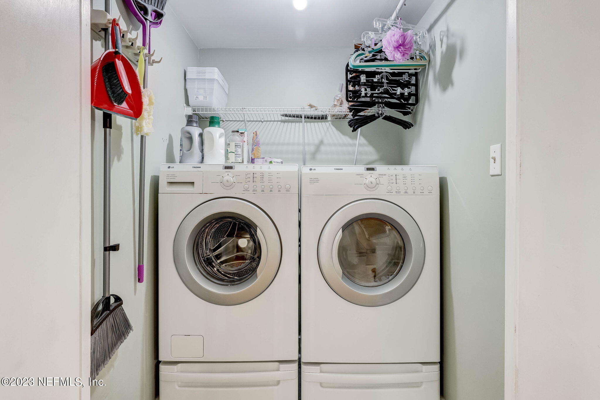 1515 Mayfair Road Jacksonville, FL 32207 - Photo 31 of 52 a view of a storage and utility room with washer and dryer