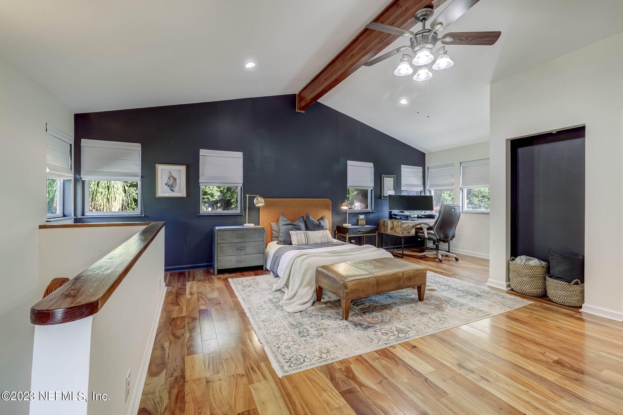 1515 Mayfair Road Jacksonville, FL 32207 - Photo 32 of 52 a bedroom with furniture and a wooden floor