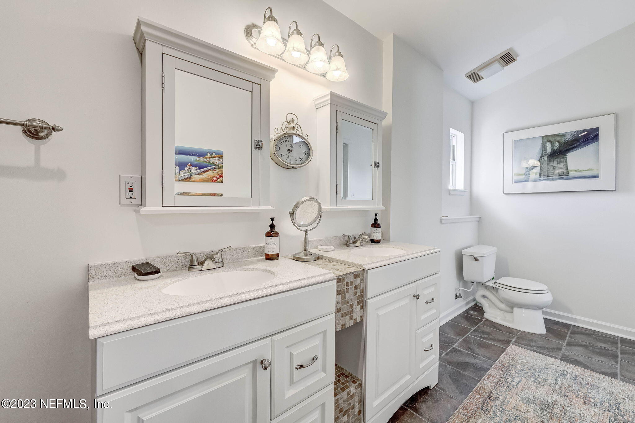 1515 Mayfair Road Jacksonville, FL 32207 - Photo 36 of 52 a spacious bathroom with sink and mirror
