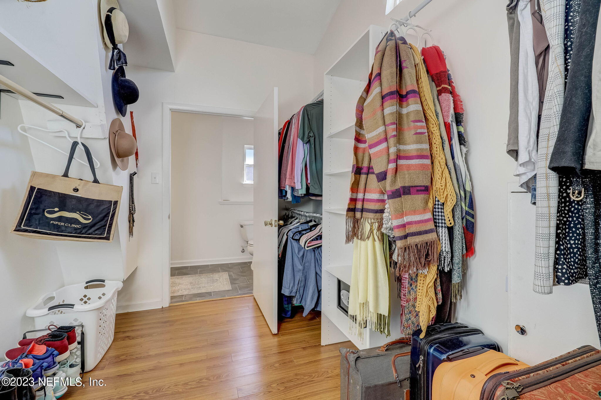 1515 Mayfair Road Jacksonville, FL 32207 - Photo 38 of 52 a view of walk in closet with clothes and shoes