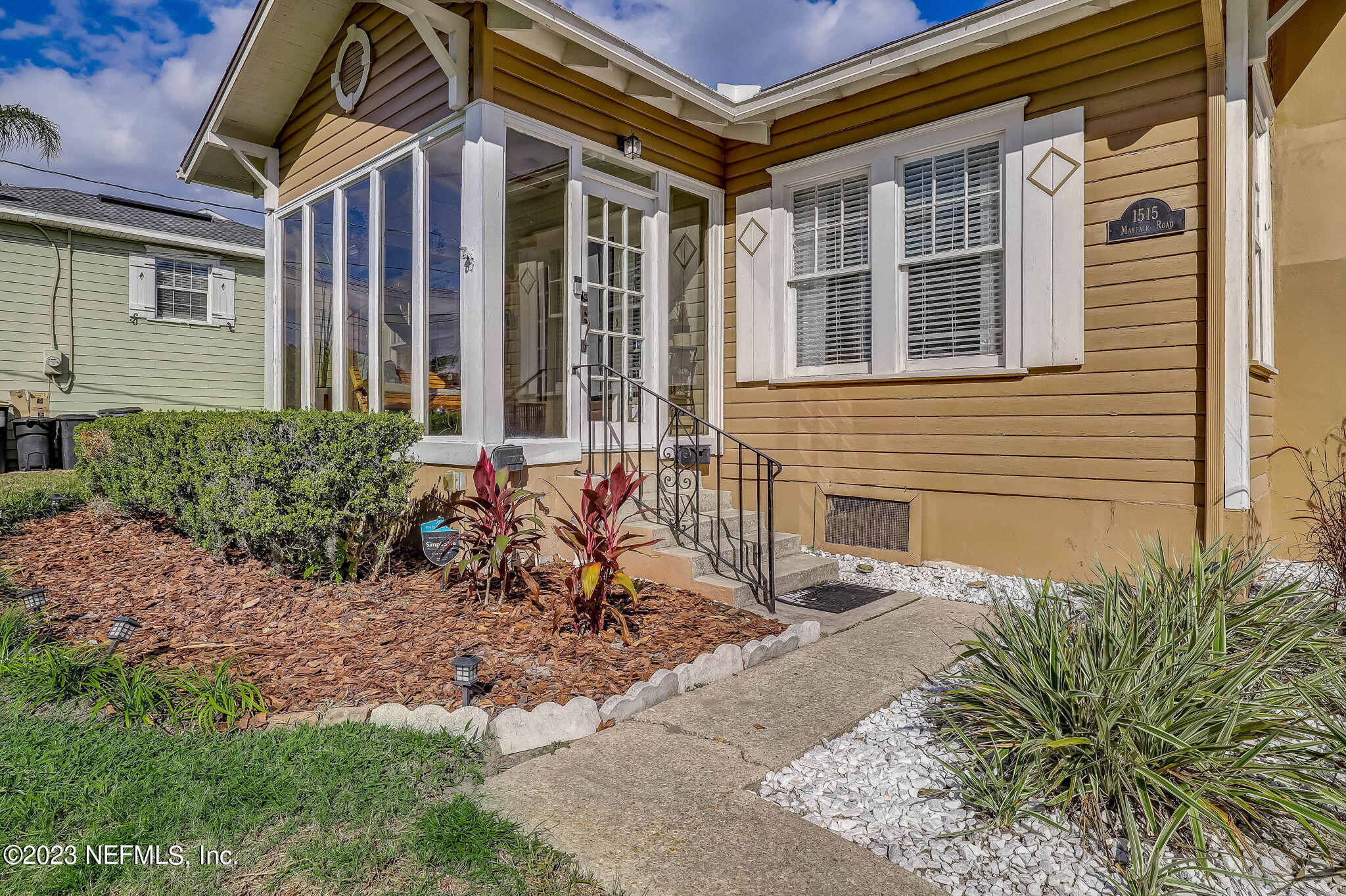 1515 Mayfair Road Jacksonville, FL 32207 - Photo 6 of 52 a front view of a house with a yard
