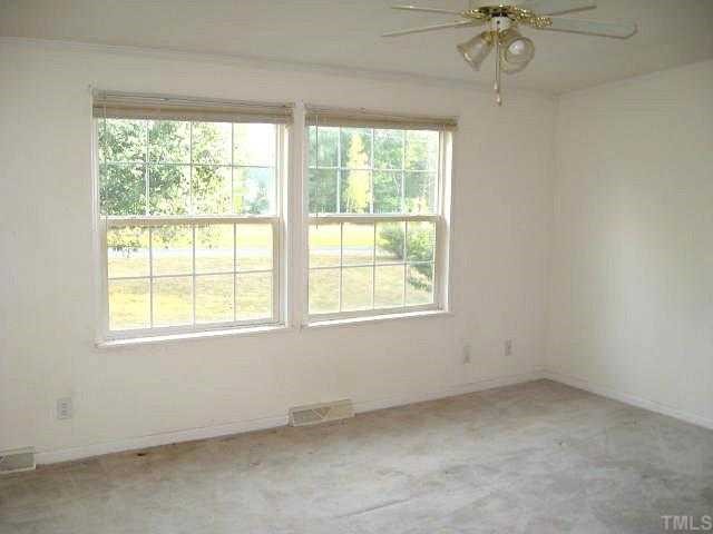 560 Pixley Pritchard Road Timberlake, NC 27583 - Photo 5 of 12 an empty room with a window