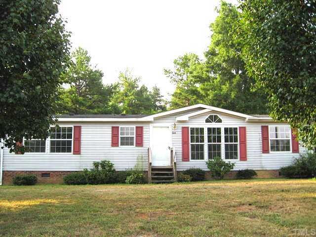 560 Pixley Pritchard Road Timberlake, NC 27583 - Photo 10 of 12 a front view of a house with a yard