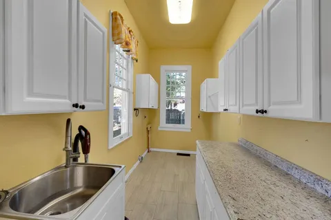 a kitchen with a sink and cabinets