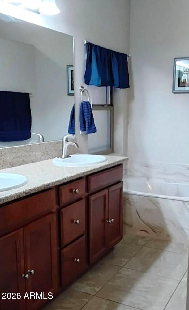 4143 North Stampede Road Kingman, AZ 86401 - Photo 13 of 28 a bathroom with a sink and a mirror