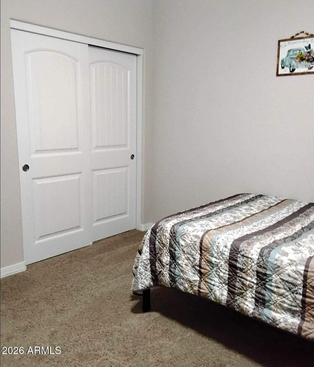 4143 North Stampede Road Kingman, AZ 86401 - Photo 19 of 28 a bedroom with a bed