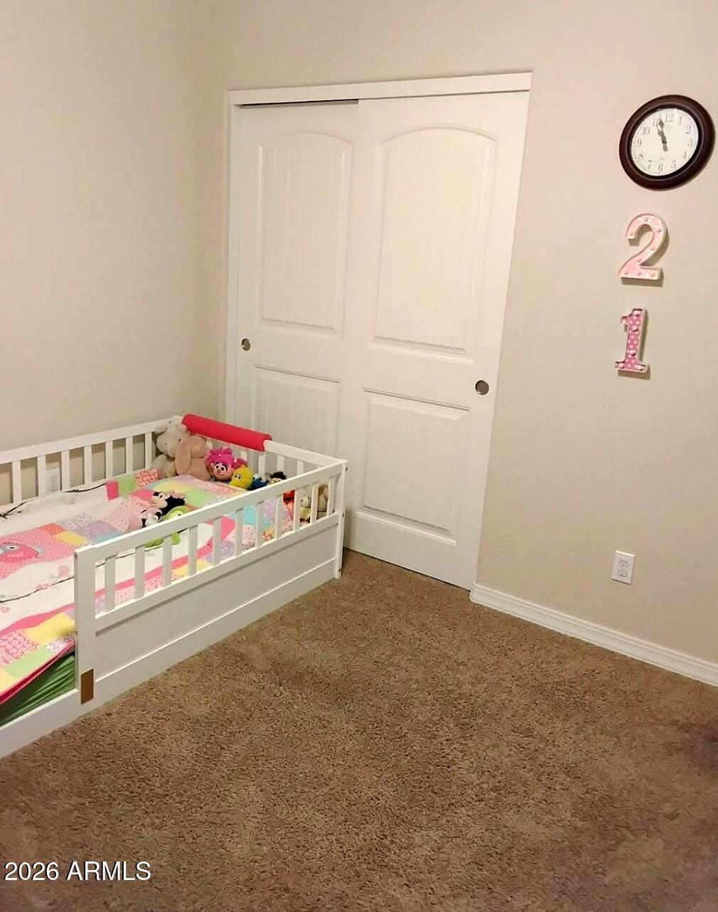 4143 North Stampede Road Kingman, AZ 86401 - Photo 20 of 28 a bedroom with a bed and a window