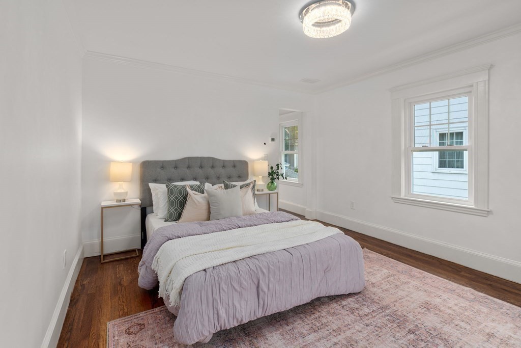 4 Clement Avenue Boston, MA 02132 - Photo 18 of 39 a bedroom with a bed and a window