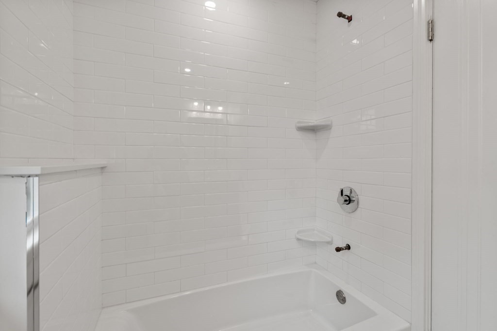 4 Clement Avenue Boston, MA 02132 - Photo 24 of 39 a close up of a bathtub