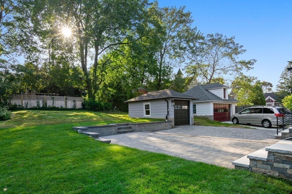 4 Clement Avenue Boston, MA 02132 - Photo 27 of 39 a view of a house with a yard and sitting area