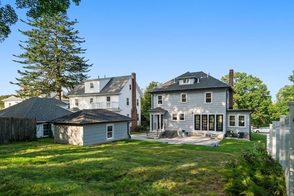 4 Clement Avenue Boston, MA 02132 - Photo 32 of 39 a front view of a house with garden