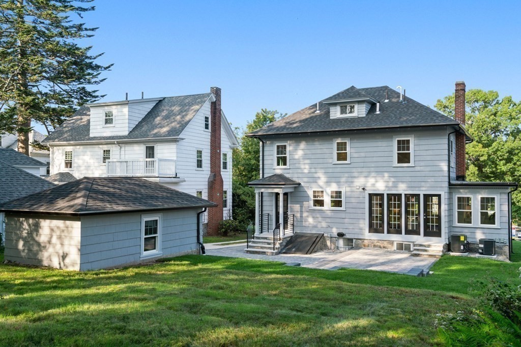 4 Clement Avenue Boston, MA 02132 - Photo 33 of 39 a front view of a house with a garden