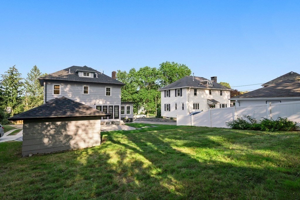 4 Clement Avenue Boston, MA 02132 - Photo 35 of 39 a front view of a house with a yard table and chairs