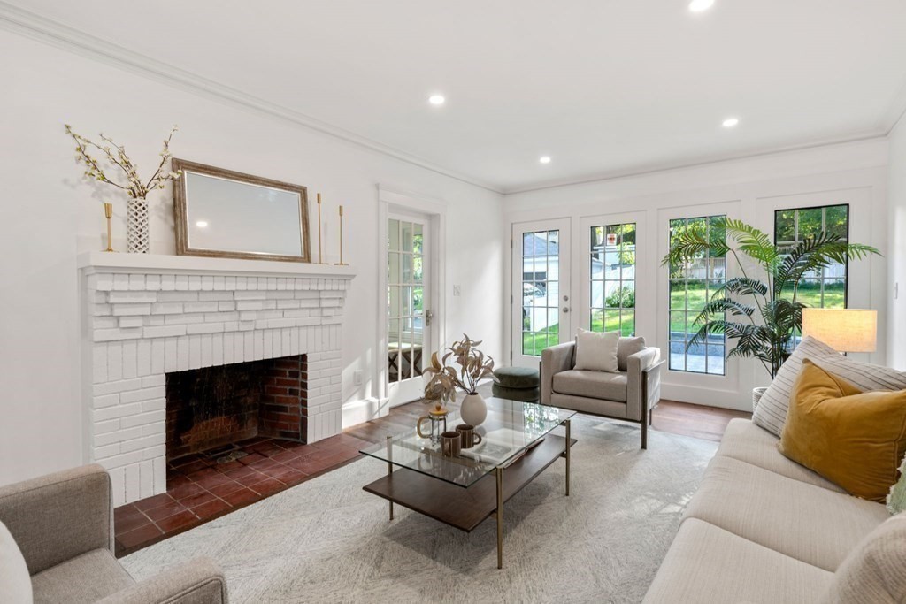 4 Clement Avenue Boston, MA 02132 - Photo 4 of 39 a living room with furniture and a fireplace