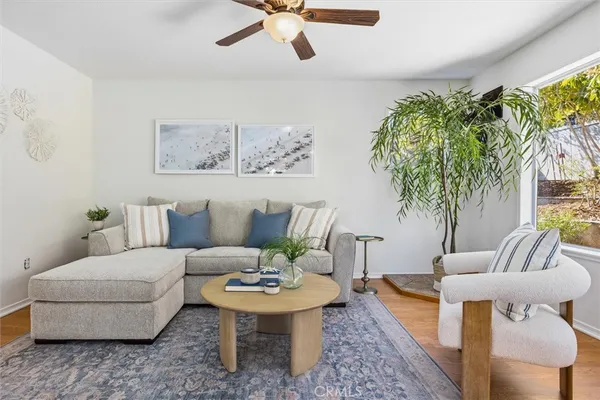 a living room with furniture and a large window