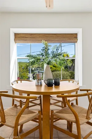 a view of a swimming pool with outdoor seating and plants