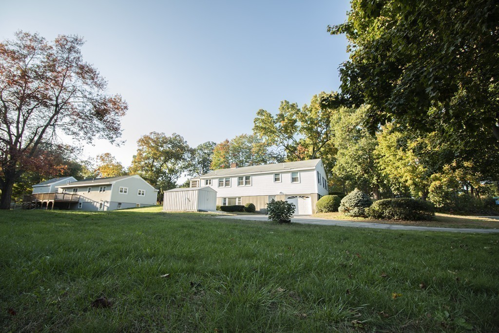 751 Wheeler Road Dracut, MA 01826 - Photo 27 of 29 a view of a house with a yard