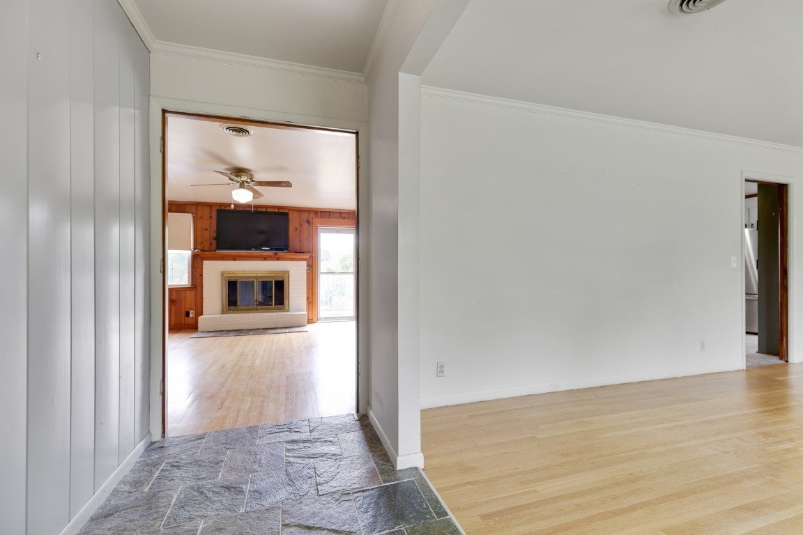 706 Ronnie Road Madison, TN 37115 - Photo 11 of 39 a view of a hallway with wooden floor and furniture